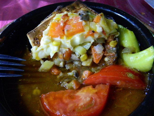 baked eggplant stuffed with potatoes, tomatoes, peppers