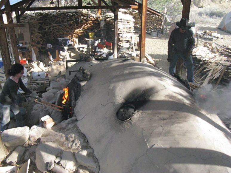 Mike and I feeding the beast from both sides with wood dropped through two side ports. 